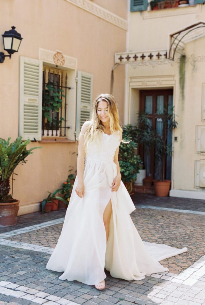 Bride wearing white wedding dress with slit in Provence Italy