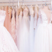 2021 bridal gowns hanging in boutique