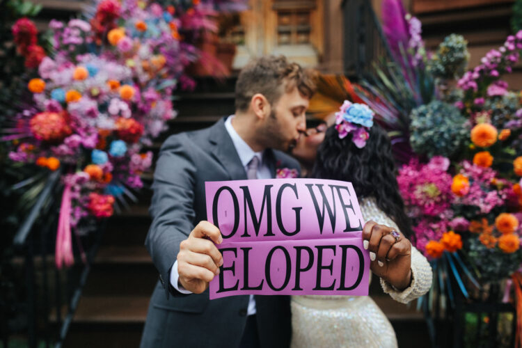interracial couple stoop wedding with vibrant flowers