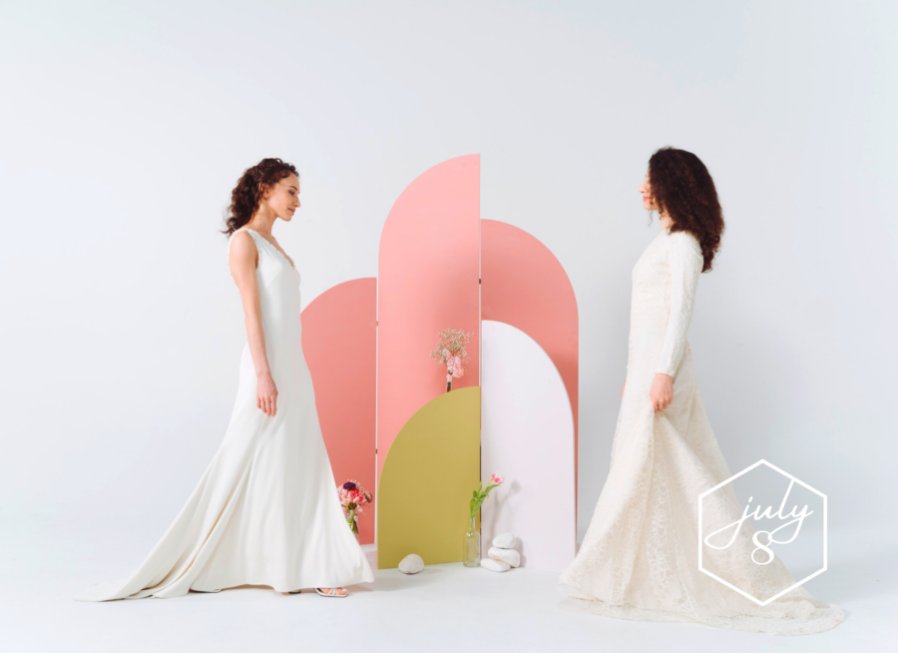 Geometric shapes form wedding altar backdrop for lesbian couple