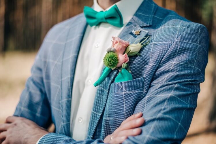 trendy groom with blue plaid suit and turquoise bow tie