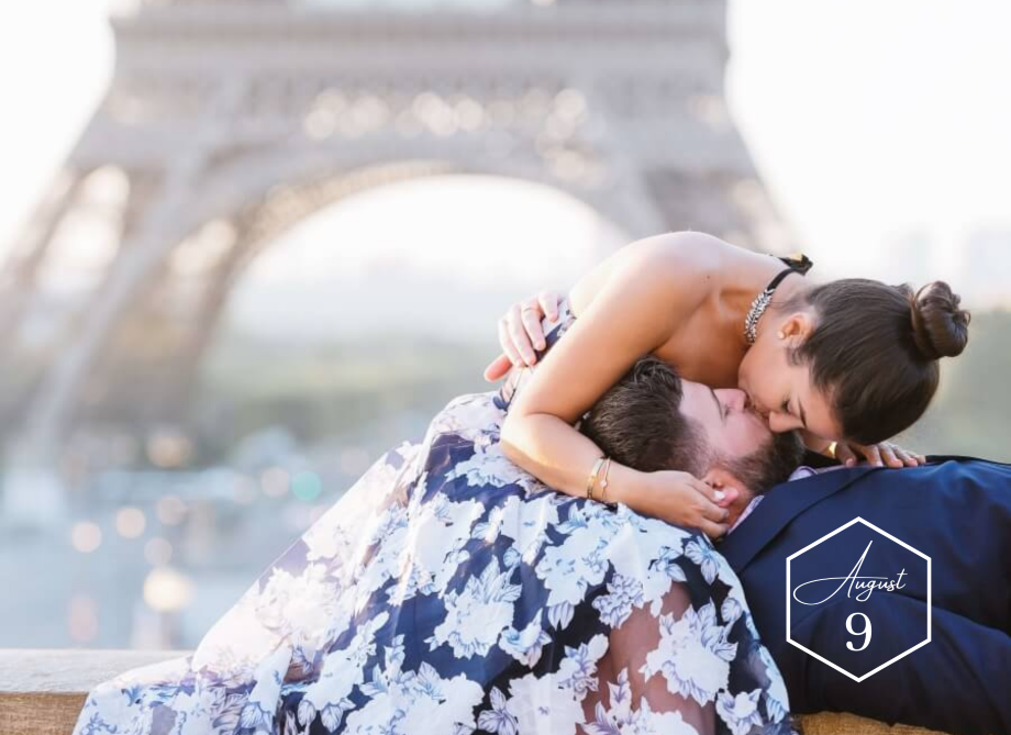 Honeymoon couple kissing in front of Eiffel tower