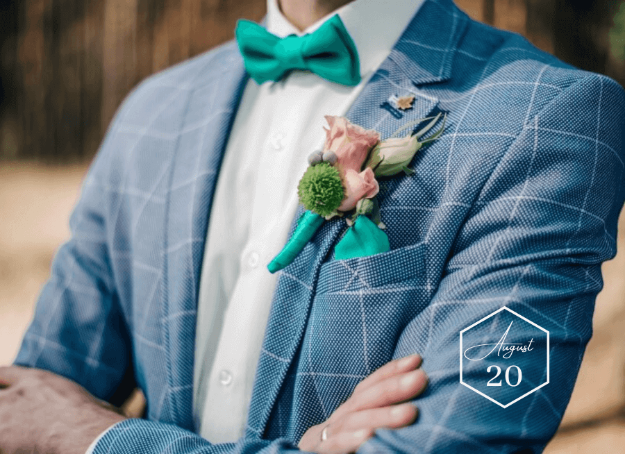 Stylish groom in blue plaid suit with green bow tie