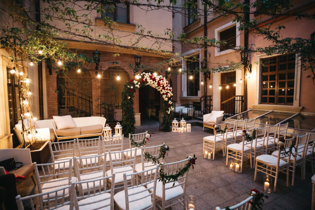 Romantic evening wedding ceremony set up in a rustic courtyard Local Wedding Venues