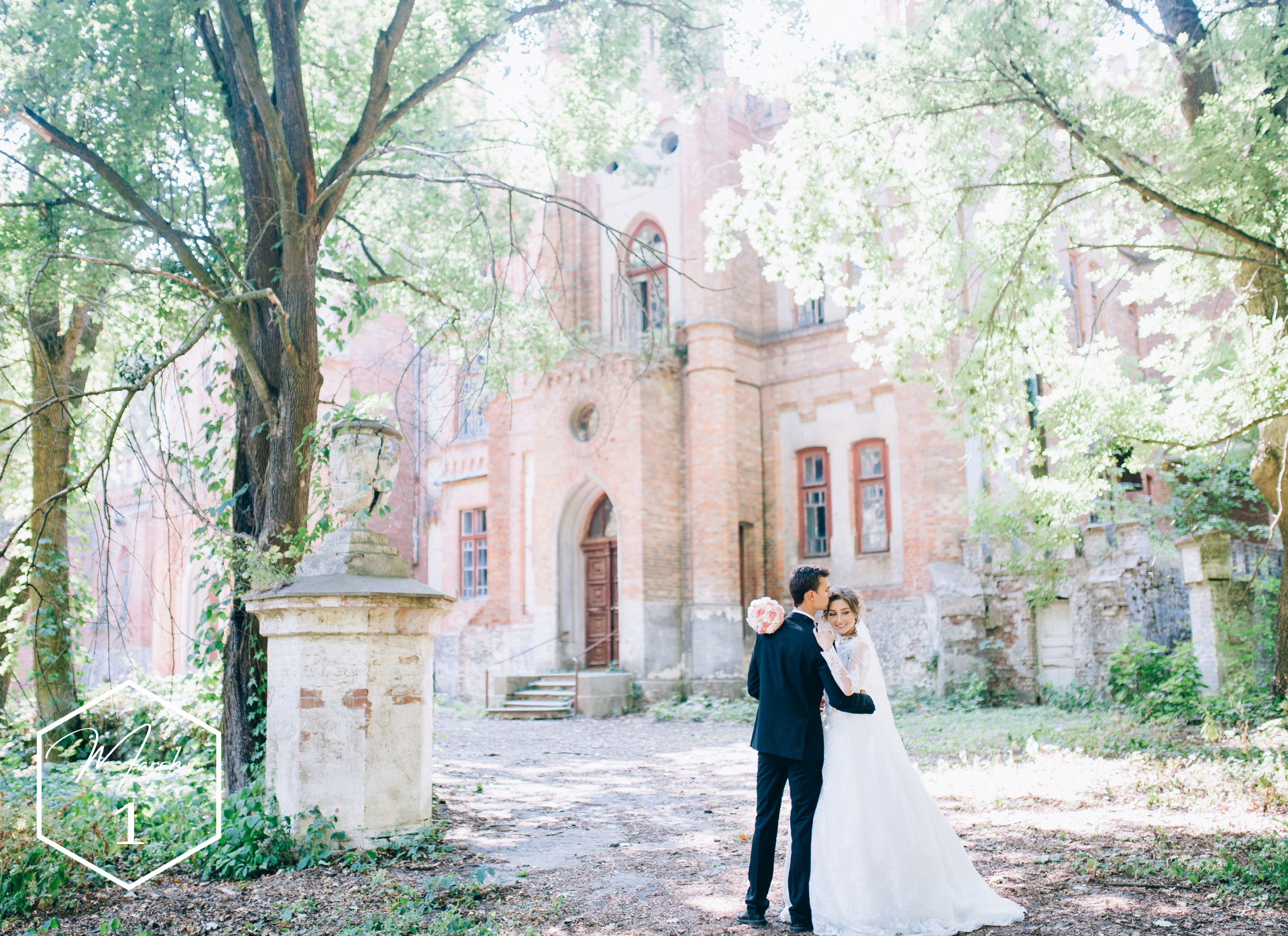 Bride and groom pose in front of stunning chateau wedding venue