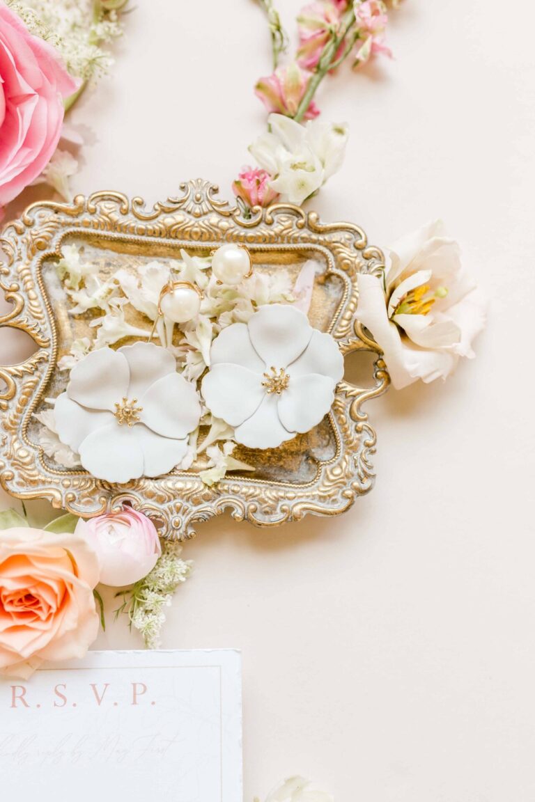 Flat lay Gold tray with white flowers wedding details flatlay