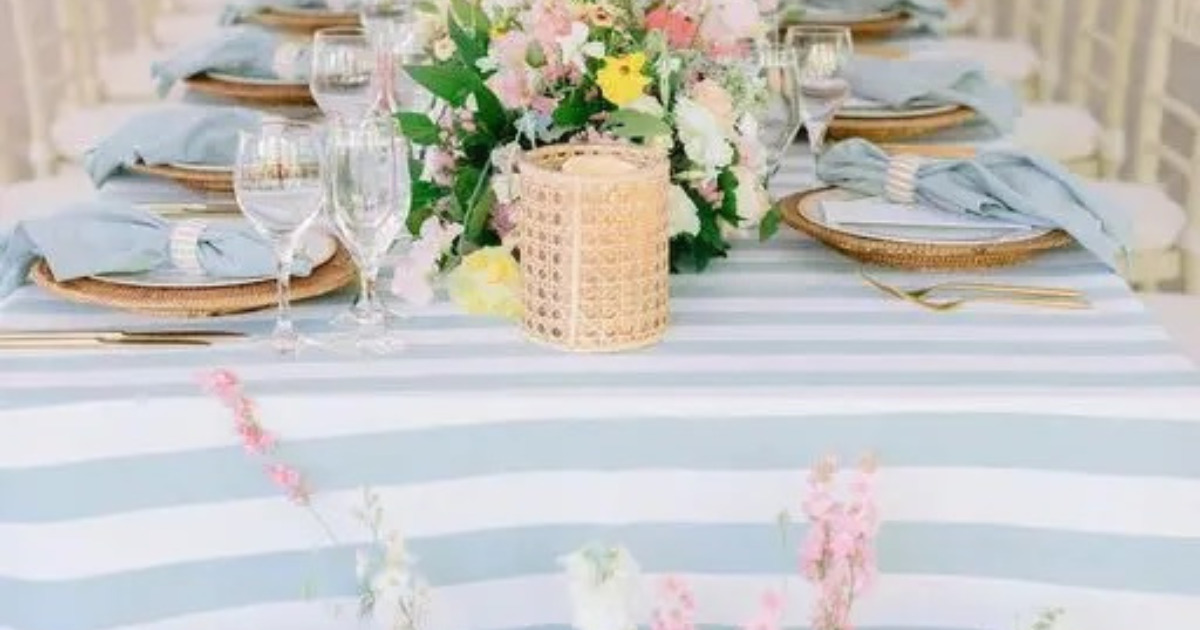 beautiful wedding table with soft blue striped wedding linen tablecloth