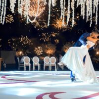 Groom dips bride on wedding dance floor