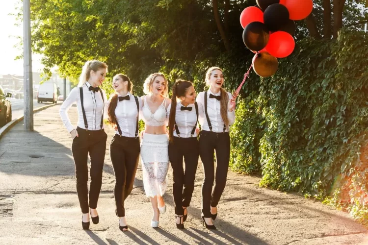UK hen dos happy-girls-going-to-celebrate-a-bachelorette-party.-Bridesmaids-dressed-in-men_s-suits