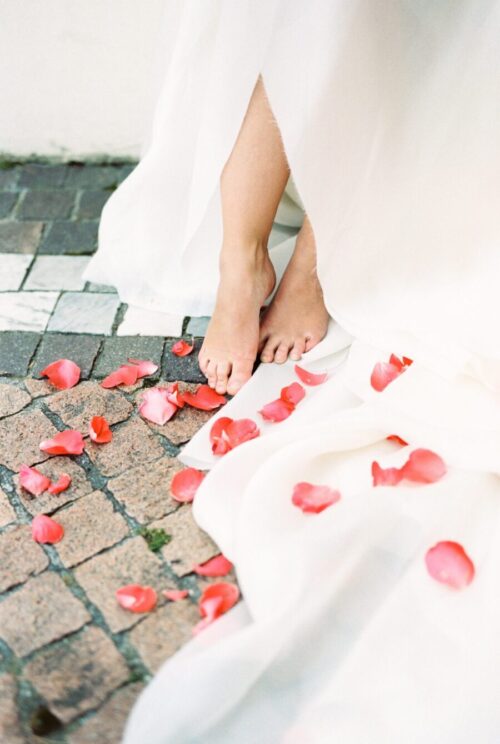 photo of brides feet on cobblestone street in Provence Italy